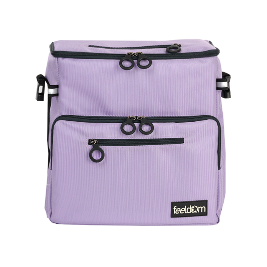 Front view of Light purple coloured, rectangular bag, with 2 reflective tags, 5 easy grip Feeldom zipper rings. Shows 1 main compartment, 2 zipped pockets in the front, 1 zipped pocket on the top. Buddy-z adaptable tote bag is Convertible between mobility aid bag, Wheelchair backpack, and crossbody bag, with special attachments.